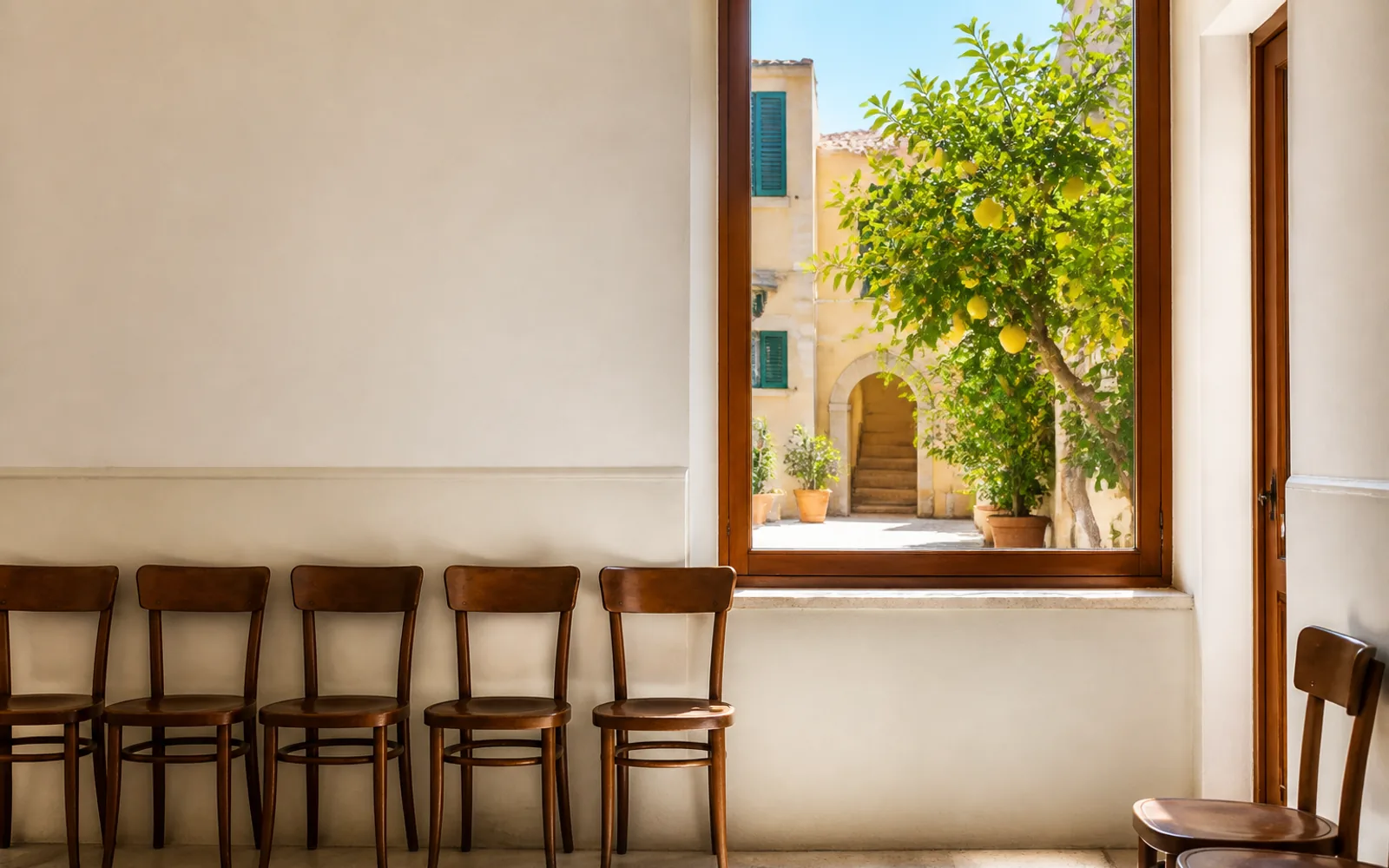 Doctor consultation in a clean Italian medical office with patient describing symptoms