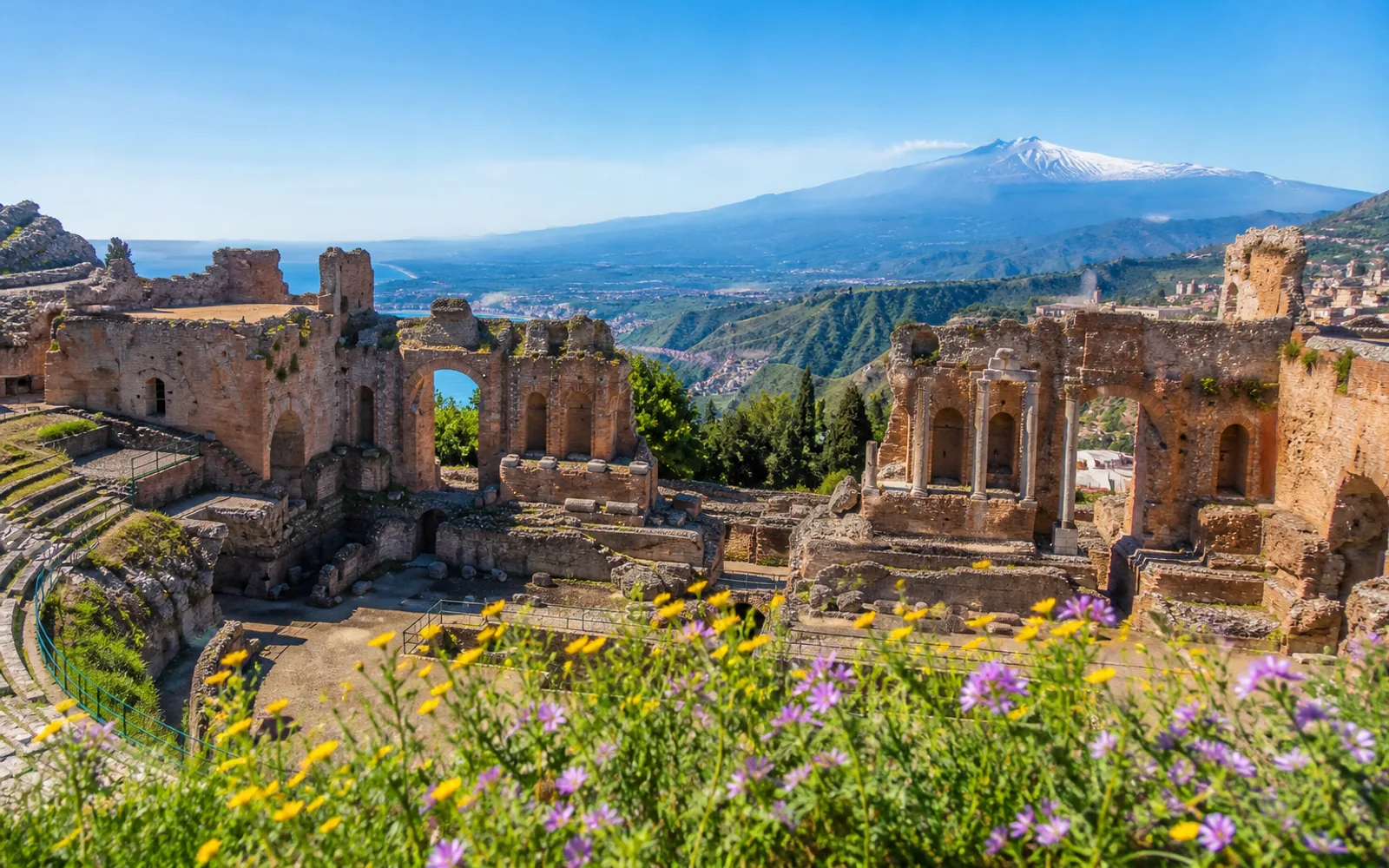 Ancient Greek theatre ruins overlooking the sea at Taormina Sicily